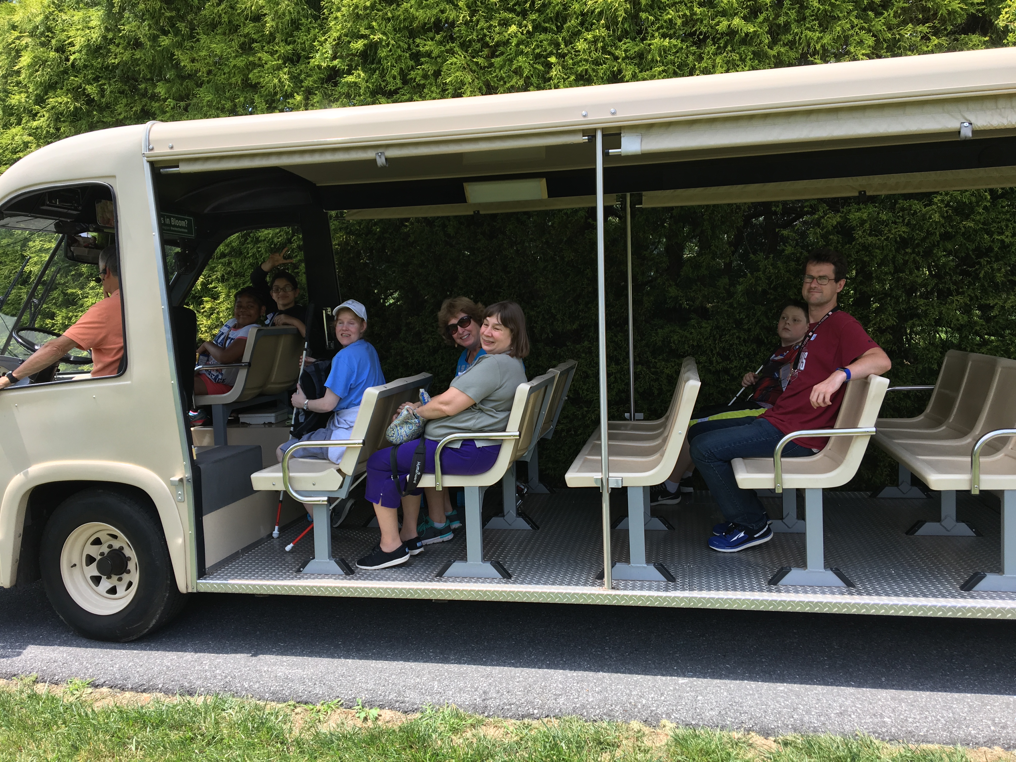 BELL Academy students and staff riding a shuttle bus toward the enchanted forest.